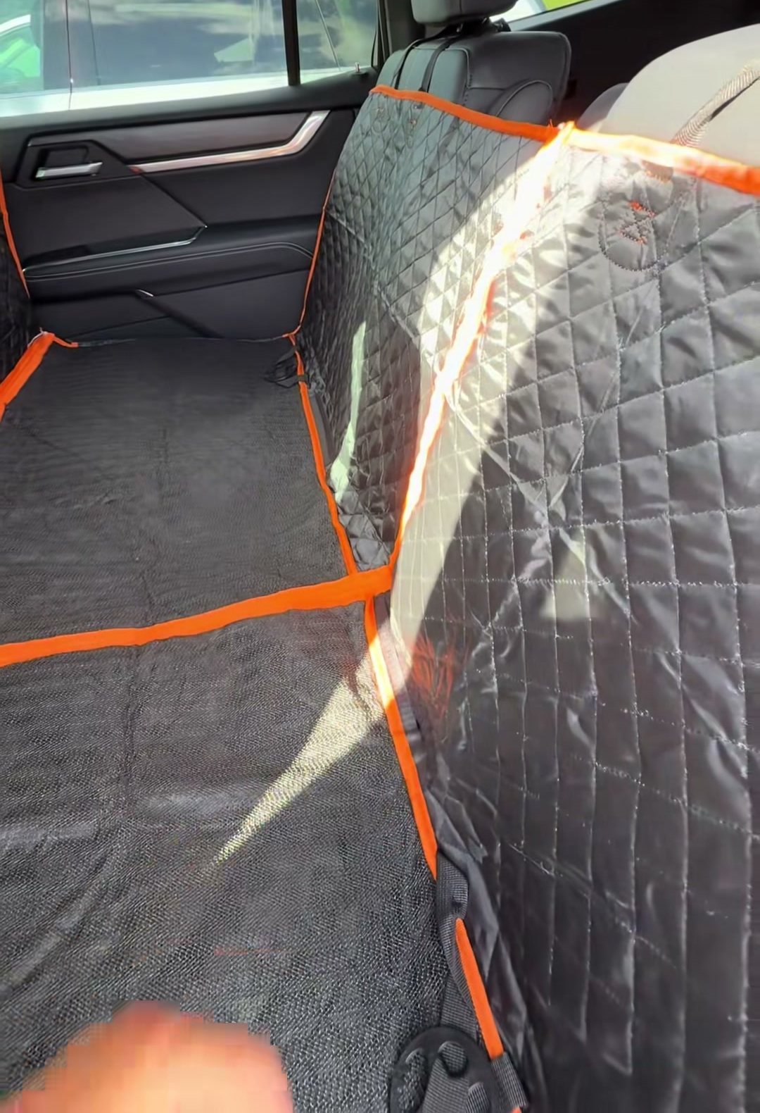 The velcro side flap running up the inside of the rear door